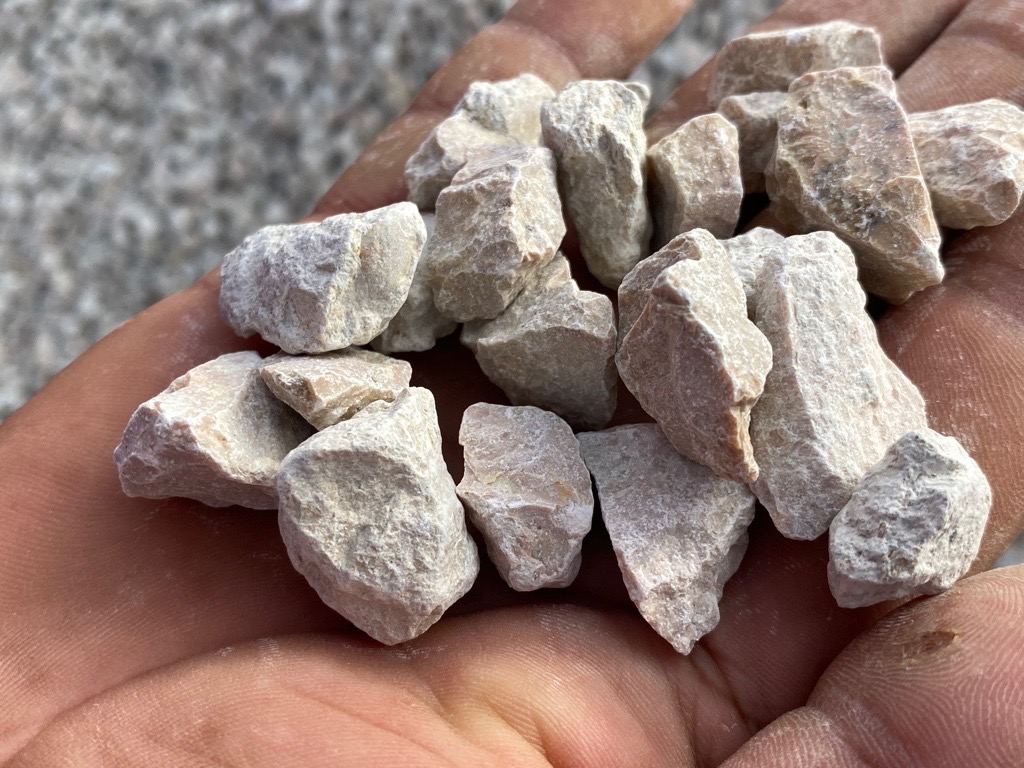 White limestone aggregate in hand