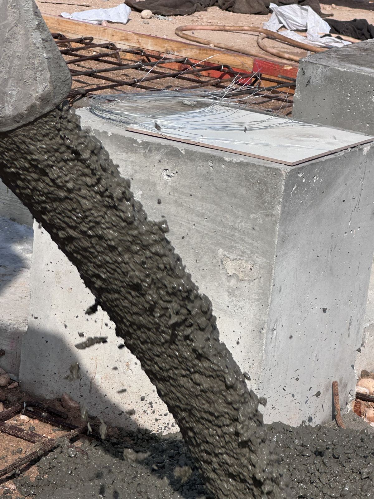 Concrete discharging from the chute onto reinforcement